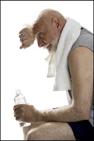 fuzz - Profile of a senior man holding a bottle of water Stock Photo - Premium Royalty-Free, Code: 640-02768177