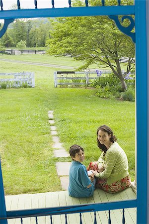 Portrait of a woman smiling with her son and smiling Stock Photo - Premium Royalty-Free, Code: 640-02768328