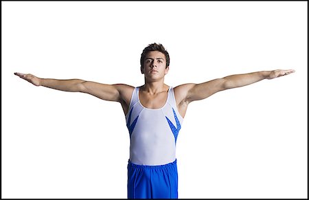 Male gymnast doing floor exercises Stock Photo - Premium Royalty-Free, Code: 640-02768475