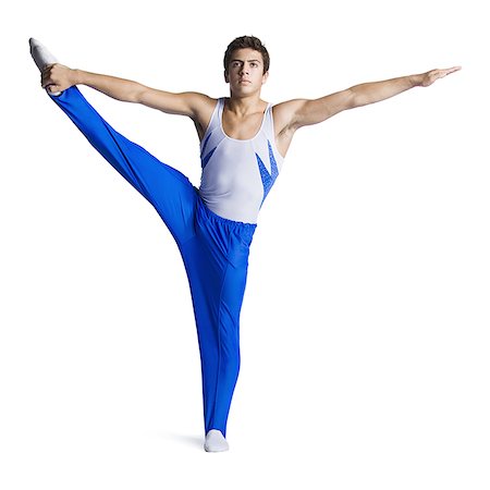 Male gymnast doing floor exercises Stock Photo - Premium Royalty-Free, Code: 640-02768478