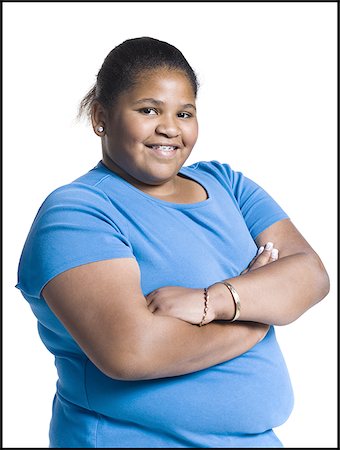 fat teen - Heavyset young woman with arms folded Stock Photo - Premium Royalty-Free, Code: 640-02768520