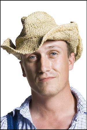 farmer with overalls - Farmer wearing a straw hat smiling Stock Photo - Premium Royalty-Free, Code: 640-02768573