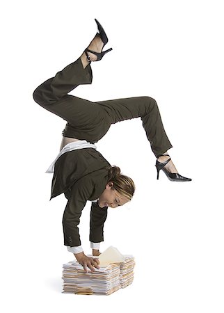 strong female acrobats - Female contortionist businesswoman Stock Photo - Premium Royalty-Free, Code: 640-02768604