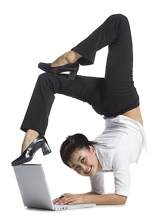 simsearch:640-02768663,k - Female contortionist businesswoman Foto de stock - Sin royalties Premium, Código: 640-02768609