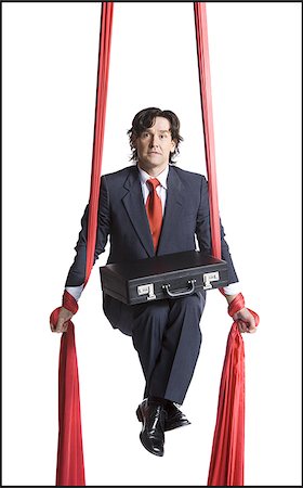 simsearch:640-02768648,k - Businessman tangled in red drapes Stock Photo - Premium Royalty-Free, Code: 640-02768653