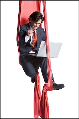 simsearch:640-01348387,k - Businessman tangled in red drapes Stock Photo - Premium Royalty-Free, Code: 640-02768660