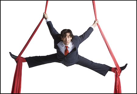 Businessman tangled in red drapes Stock Photo - Premium Royalty-Free, Code: 640-02768662