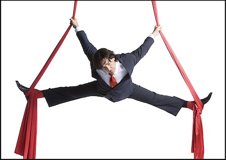 Businessman tangled in red drapes Stock Photo - Premium Royalty-Free, Code: 640-02768663