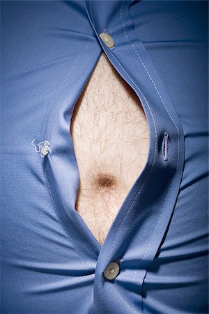 pot belly - Close-up of fat stomach bursting through shirt Stock Photo - Premium Royalty-Free, Code: 640-02768711