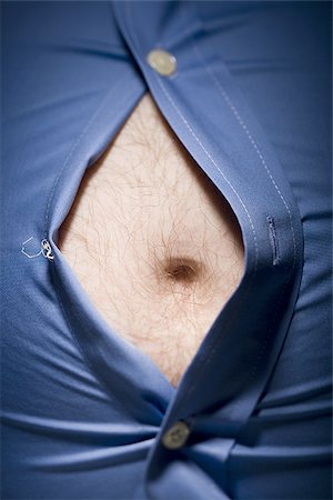 pot belly - Close-up of fat stomach bursting through shirt Stock Photo - Premium Royalty-Free, Code: 640-02768712