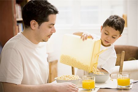 simsearch:640-03262648,k - Father and young son having breakfast together Stock Photo - Premium Royalty-Free, Code: 640-02768770