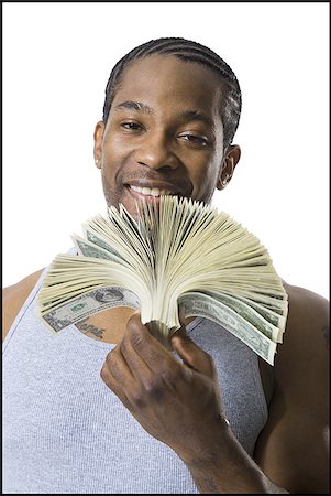 simsearch:640-03260699,k - African American holding a pile of dollar bills Foto de stock - Sin royalties Premium, Código: 640-02768884