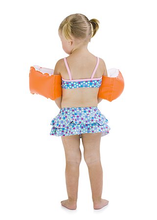 Young girl with personal flotation devices around arms Foto de stock - Sin royalties Premium, Código: 640-02769069