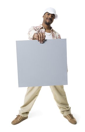 simsearch:640-01361763,k - ,African-Ethnicity,man holding a blank sign Stock Photo - Premium Royalty-Free, Code: 640-02769095