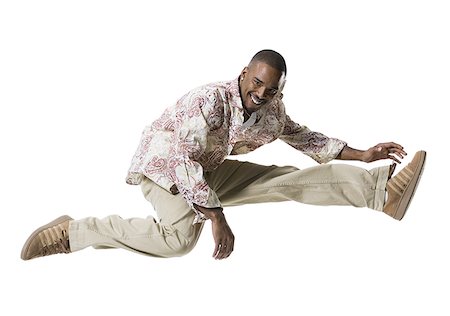 simsearch:640-01362697,k - African American man jumping Foto de stock - Sin royalties Premium, Código: 640-02769099