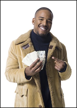 simsearch:640-03260699,k - African American man holding a pile of dollar bills Foto de stock - Sin royalties Premium, Código: 640-02769124