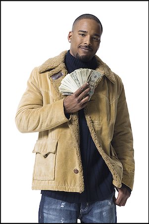 simsearch:640-03260699,k - African American man holding a pile of dollar bills Foto de stock - Sin royalties Premium, Código: 640-02769123