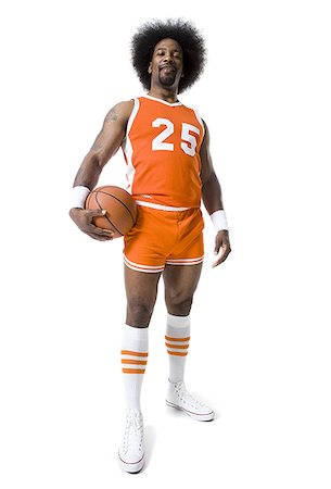 simsearch:640-01364674,k - Joueur de basket-ball avec une coupe afro orange uniforme Photographie de stock - Premium Libres de Droits, Code: 640-02769190