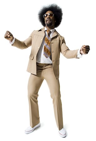 Man with an afro in beige suit Stock Photo - Premium Royalty-Free, Code: 640-02769202