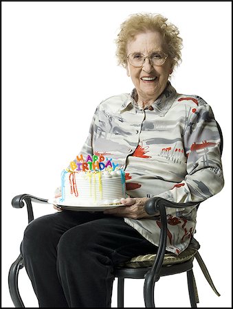 Elderly woman on her birthday with cake Stock Photo - Premium Royalty-Free, Code: 640-02769389