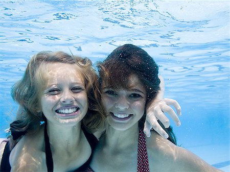 family underwater in a pool - Girls swimming underwater in pool Stock Photo - Premium Royalty-Free, Code: 640-02769491