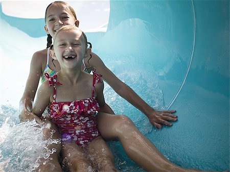 preteen one piece swimsuit - Girls on a waterslide Stock Photo - Premium Royalty-Free, Code: 640-02769513