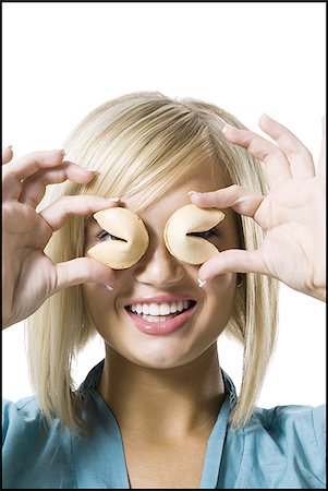 Woman with fortune cookies Foto de stock - Royalty Free Premium, Número: 640-02769685