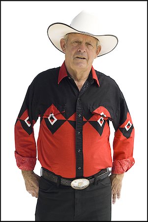 Older man in a western shirt with a cowboy hat Stock Photo - Premium Royalty-Free, Code: 640-02769762