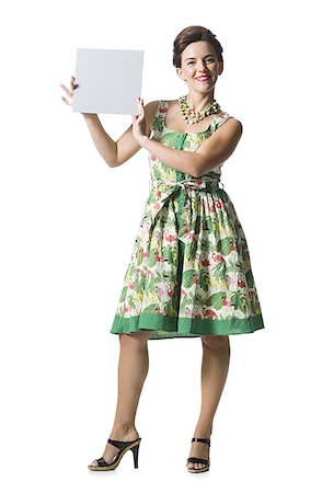 simsearch:640-01355807,k - Woman in floral dress holding a blank sign Stock Photo - Premium Royalty-Free, Code: 640-02769848