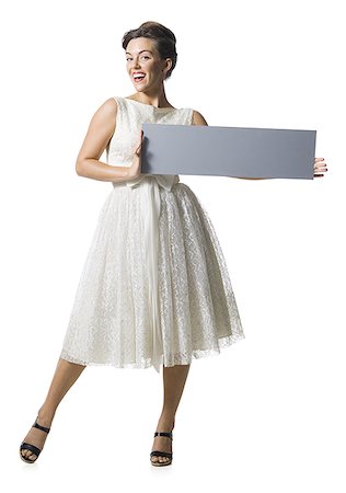 simsearch:640-01355807,k - Woman in white dress holding a blank sign Foto de stock - Sin royalties Premium, Código: 640-02769859
