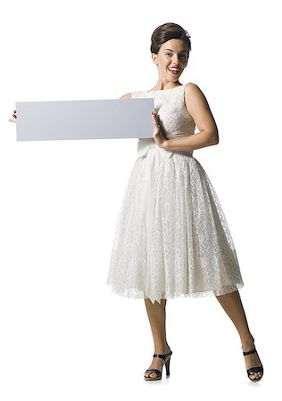 simsearch:640-01355807,k - Woman in white dress holding a blank sign Foto de stock - Sin royalties Premium, Código: 640-02769860