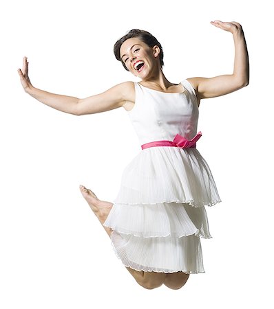 simsearch:640-01355807,k - Woman in white dress jumping Foto de stock - Sin royalties Premium, Código: 640-02769874
