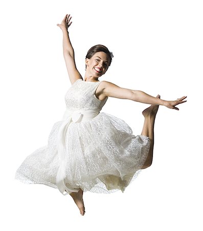 simsearch:640-01355807,k - Woman in white dress jumping Foto de stock - Sin royalties Premium, Código: 640-02769875