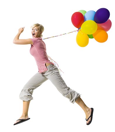 picture of a women with helium balloons - Woman with helium balloons Stock Photo - Premium Royalty-Free, Code: 640-02769932