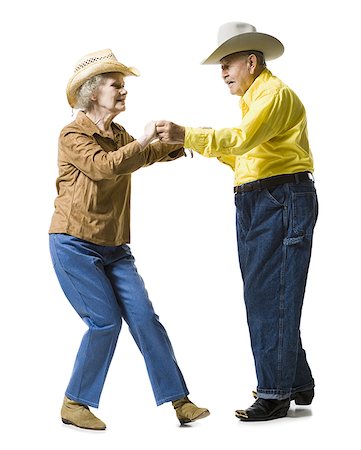Older couple in western clothing dancing Stock Photo - Premium Royalty-Free, Code: 640-02769984