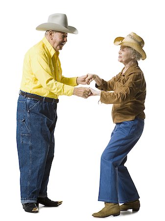 Older couple in western clothing dancing Stock Photo - Premium Royalty-Free, Code: 640-02769985