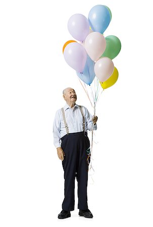 party baloons cutouts - Older man holding balloons Stock Photo - Premium Royalty-Free, Code: 640-02769994