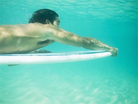 surfer underwater - Man underwater water with surfboard Stock Photo - Premium Royalty-Free, Code: 640-02774107