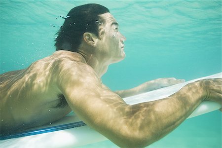 surfer underwater - Man underwater water with surfboard Stock Photo - Premium Royalty-Free, Code: 640-02774109