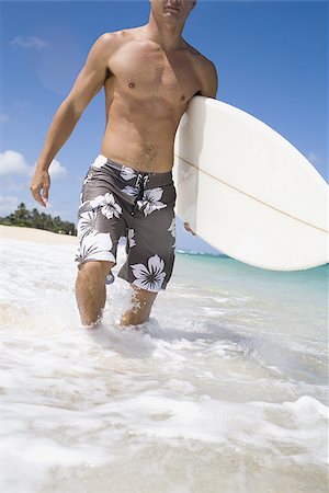 simsearch:640-02773714,k - Man walking with surfboard Fotografie stock - Premium Royalty-Free, Codice: 640-02774114