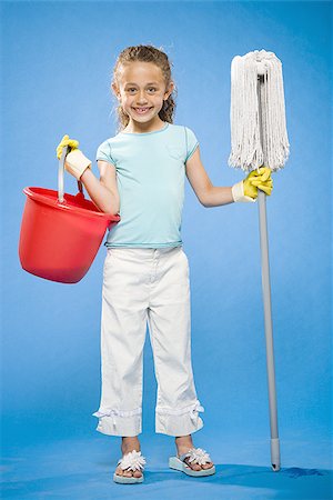 simsearch:640-02765240,k - Girl holding mop and bucket with rubber gloves smiling Foto de stock - Sin royalties Premium, Código: 640-02774406