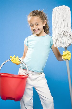 simsearch:640-02765240,k - Girl holding mop and bucket with rubber gloves smiling Foto de stock - Sin royalties Premium, Código: 640-02774408