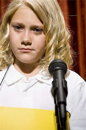 preteen cry pic - Girl contestant standing at microphone crying Stock Photo - Premium Royalty-Free, Code: 640-02774531