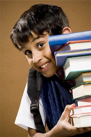 simsearch:640-02774365,k - Boy holding pile of textbooks Stock Photo - Premium Royalty-Free, Code: 640-02774604