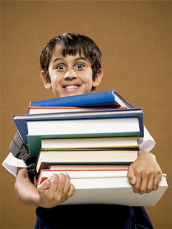 simsearch:640-02774365,k - Boy holding pile of textbooks Stock Photo - Premium Royalty-Free, Code: 640-02774605