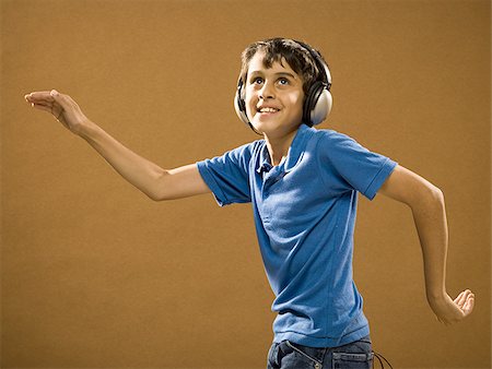 simsearch:640-02774365,k - Boy with headphones smiling and waving hands Stock Photo - Premium Royalty-Free, Code: 640-02774646