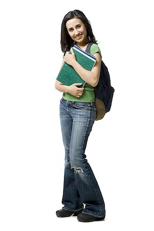 Woman with backpack and books smiling Stock Photo - Premium Royalty-Free, Code: 640-02774804