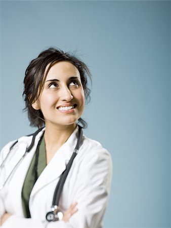 simsearch:640-03263187,k - Female doctor with arms crossed smiling Stock Photo - Premium Royalty-Free, Code: 640-02774816