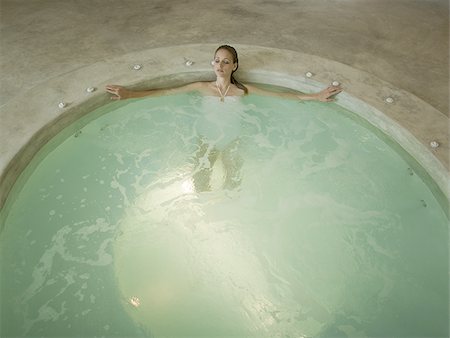 Woman in hot tub indoors Stock Photo - Premium Royalty-Free, Code: 640-02774986