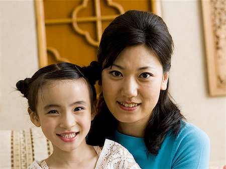 simsearch:640-01601434,k - Mother and daughter embracing and smiling Stock Photo - Premium Royalty-Free, Code: 640-02775113